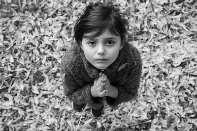 Portrait of cute girl lying outdoors