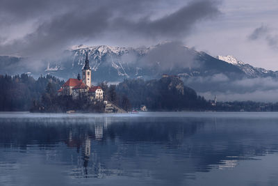 The bled monastery in the lake during a misty morning