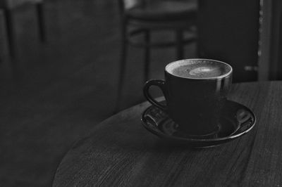 Close-up of coffee cup on table