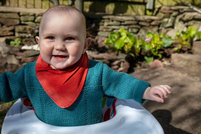 Portrait of cute boy smiling outdoors