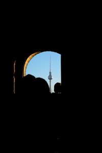 Silhouette of tower at night