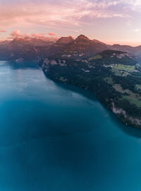 Scenic view of lake against cloudy sky