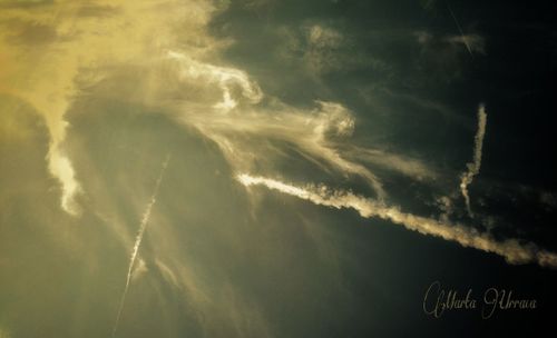 Low angle view of vapor trails in sky