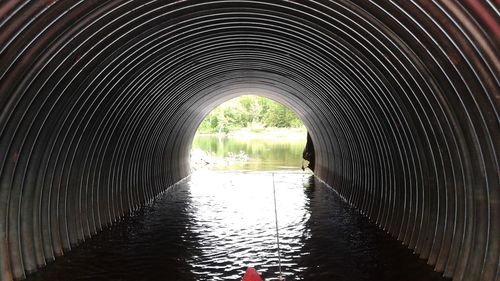 Water in savage pipe against river