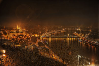 High angle view of illuminated bridge over river at night