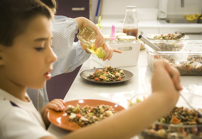 Close-up of man eating food