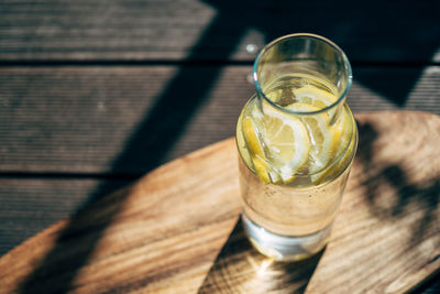 High angle view of lemon slices in drink on table