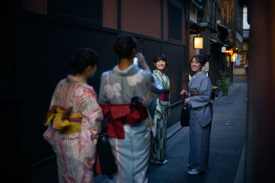 Group of people standing in front of building