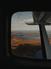 View of landscape through airplane window
