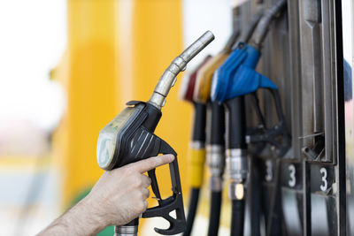 Cropped hand of man holding equipment