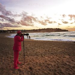 Full length of woman standing on beach