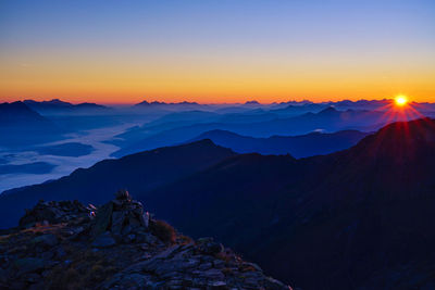 Scenic view of mountains against sky during sunset