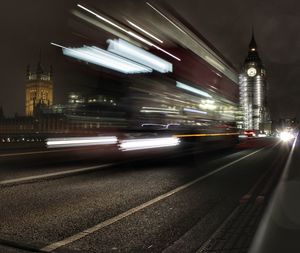 Light trails on road in city at night