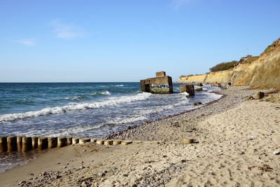 Scenic view of beach against clear sky