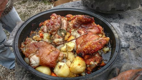 View of meat and potatoes being cooked in pan