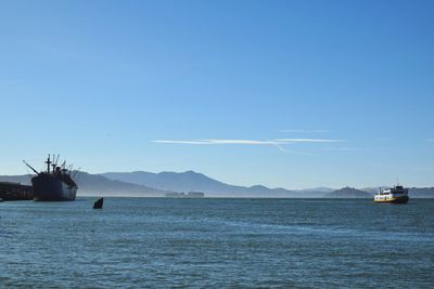 Scenic view of sea against clear blue sky