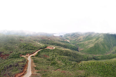 Scenic view of road amidst landscape against sky