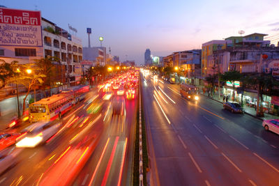 High angle view of light trails in city at night