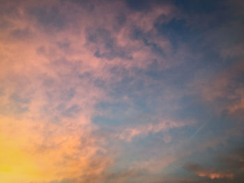 Low angle view of dramatic sky during sunset