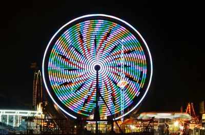 Low angle view of illuminated ferris wheel