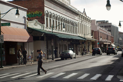 People walking on street in city