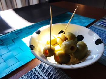 Close-up of fruits in plate on table