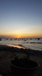 Scenic view of sea against clear sky during sunset