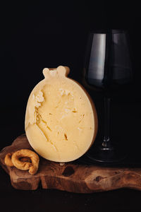 Close-up of drink on table against black background