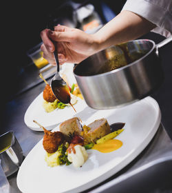 Midsection of man preparing food