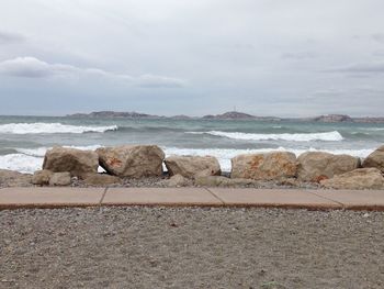 Scenic view of sea against cloudy sky