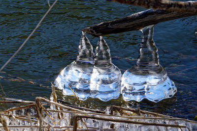 High angle view of bottles in lake