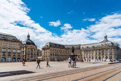 Group of people in front of historical building