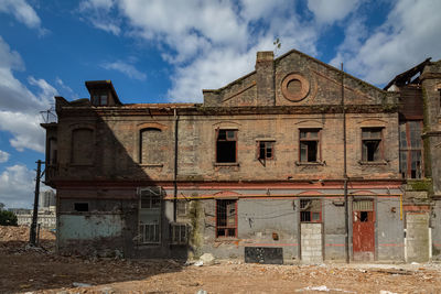 Low angle view of old building against sky