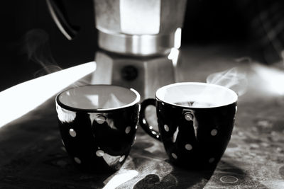 Close-up of coffee cup on table