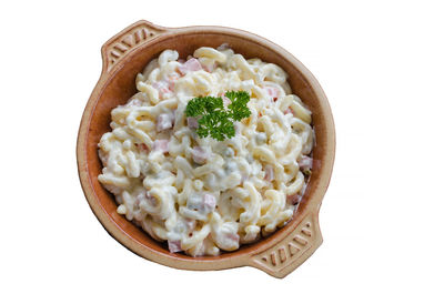 High angle view of pasta in bowl against white background