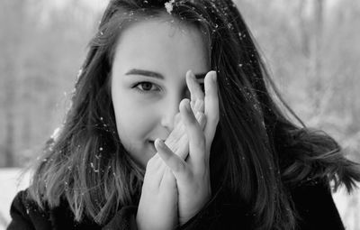 Close-up portrait of teenage girl during winter