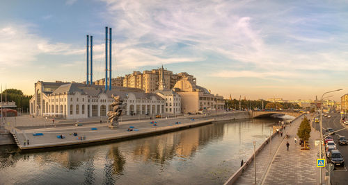 Bridge over river against sky during sunset