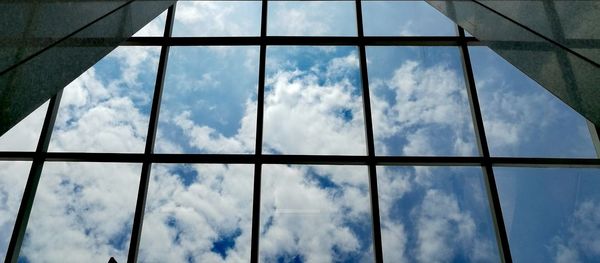 Low angle view of sky seen through window
