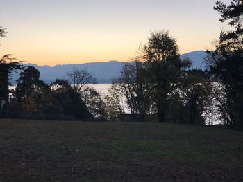 Scenic view of field against sky during sunset