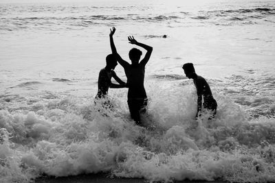 Cheerful people enjoying in sea