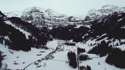 Scenic view of snow covered mountains against sky