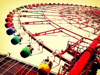 Low angle view of ferris wheel against sky