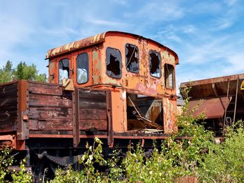 Old rusty train against sky