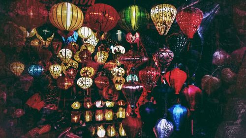 Close-up of illuminated lanterns hanging at night