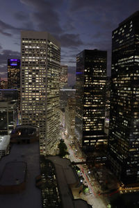 High angle view of illuminated buildings in city at night