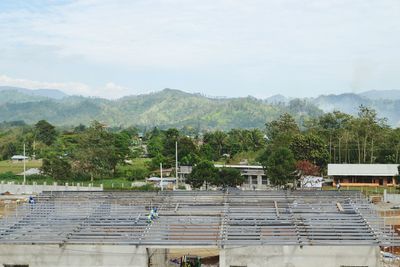 High angle view of trees and mountains against sky