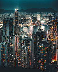 High angle view of illuminated modern buildings in city