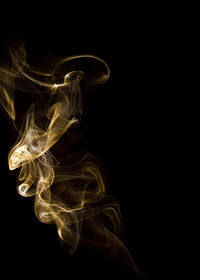 Close-up of smoke against black background