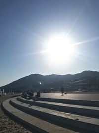 Scenic view of mountains against sky on sunny day