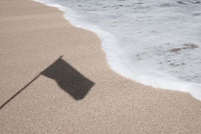 High angle view of shadow on beach